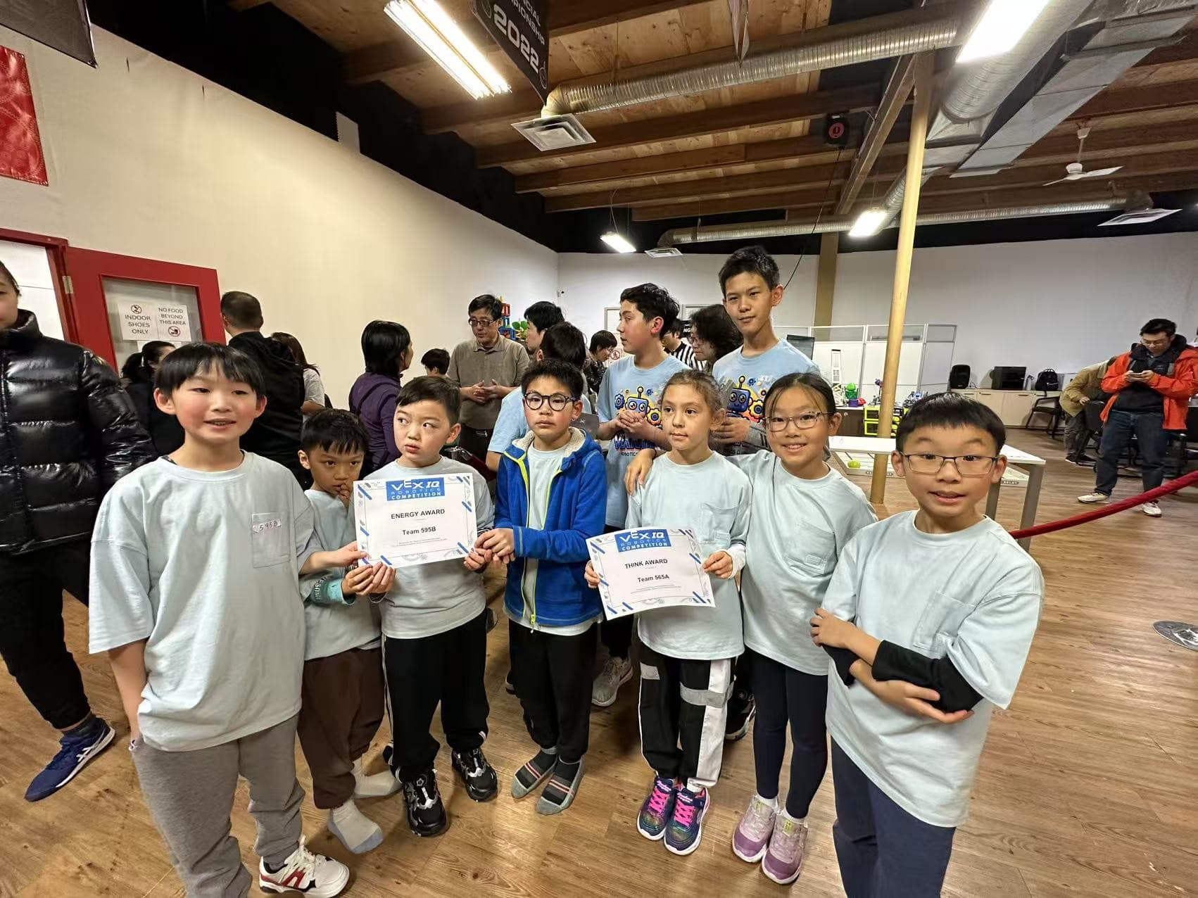 Members of 565A and 595B together after the January Showdown, holding the Think Award and Energy Award certificates.