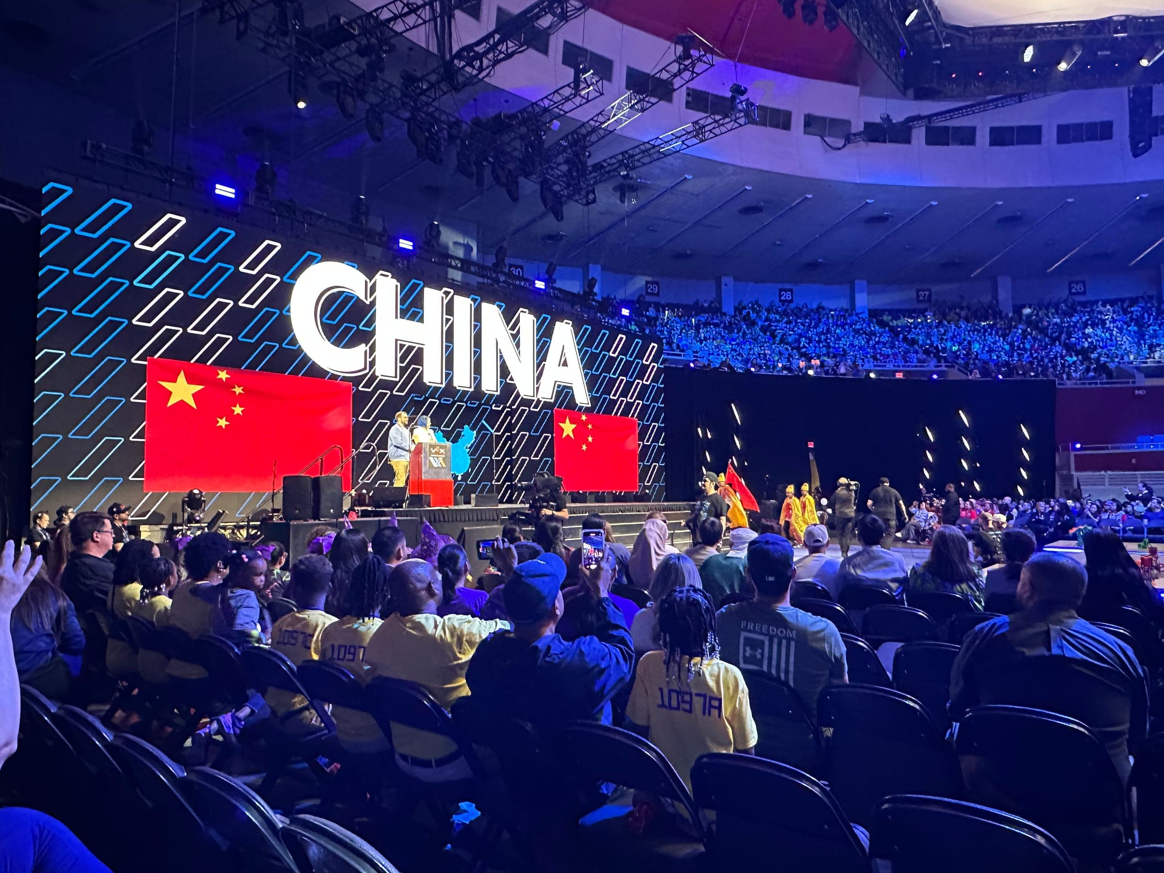 The opening ceremony, with China's name and flag filling the screen behind the stage as that country's teams are welcomed in.